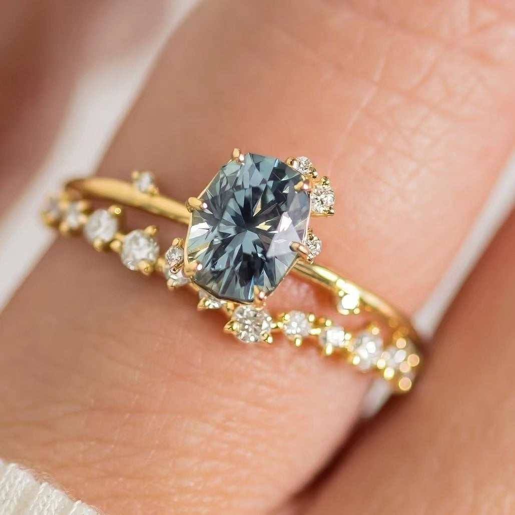 “Luxury Blue Gemstone Gold Ring – Elegant Sparkle Design”