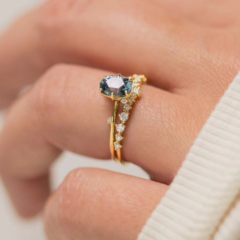 “Luxury Blue Gemstone Gold Ring – Elegant Sparkle Design”